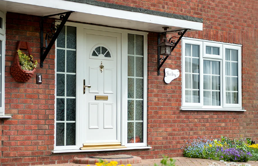 White front door on a red brick house