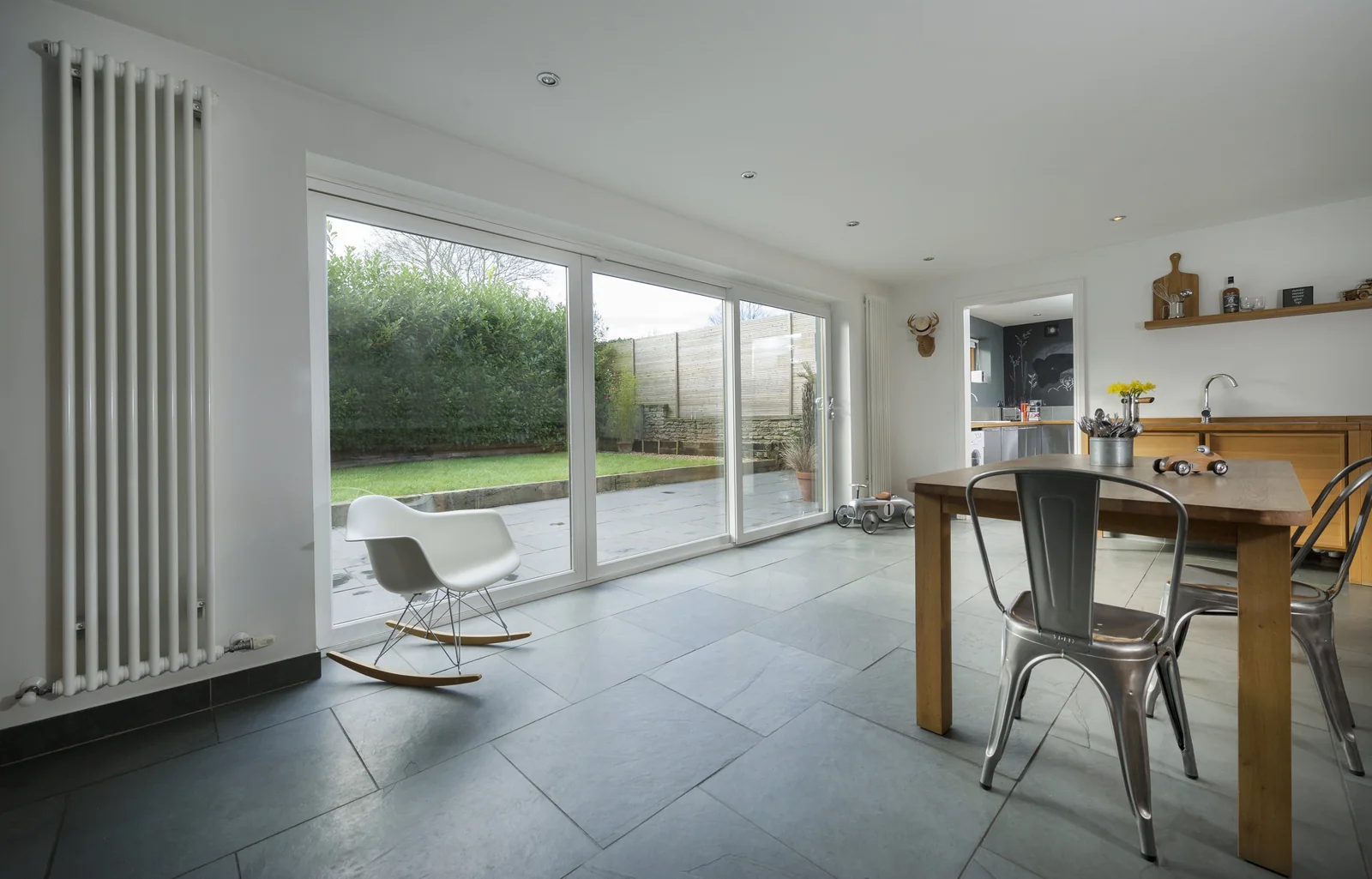 Bright open plan room with wide glazed doors